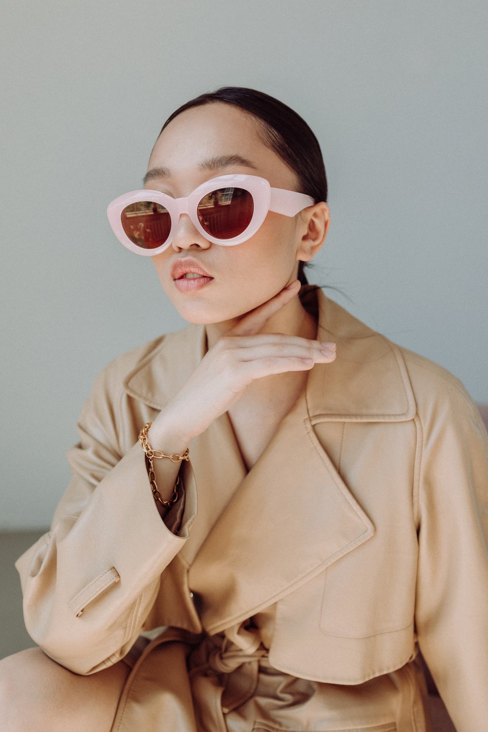 Stylish Woman in Coat and Sunglasses